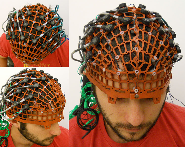 GiacoWeb used to position 65 EEG electrodes following the 10-10 coordinates and 24 NIRS optodes on the sensorimotor cortex on a male adult head.