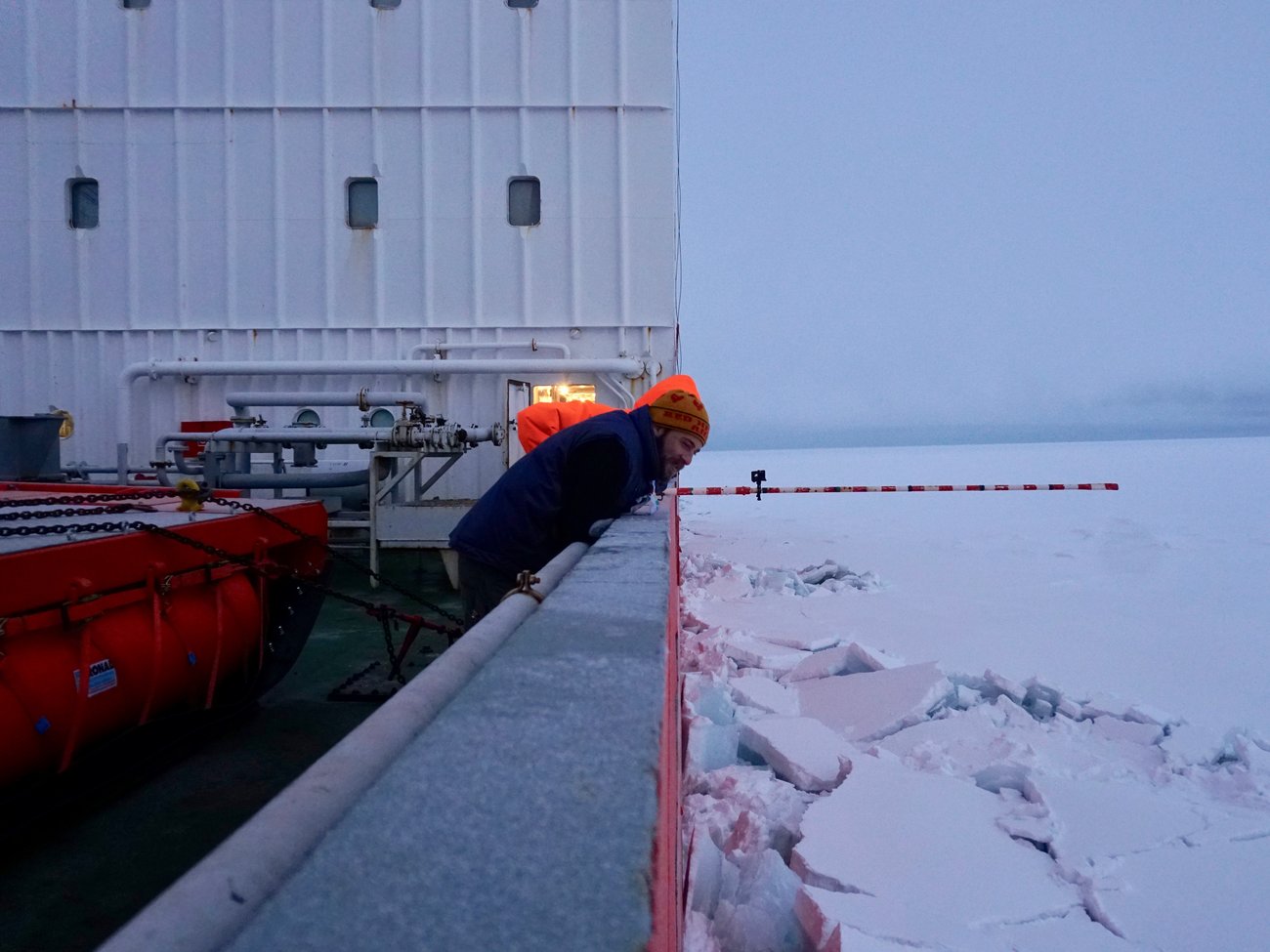 Ian Raphael watches as the Akademik Fedorov tests the thickness of an ice floe by driving through it.