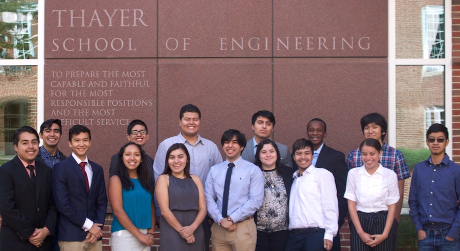 Members of Society of Hispanic Professional Engineering standing in front of Thayer School of Engineering motto.
