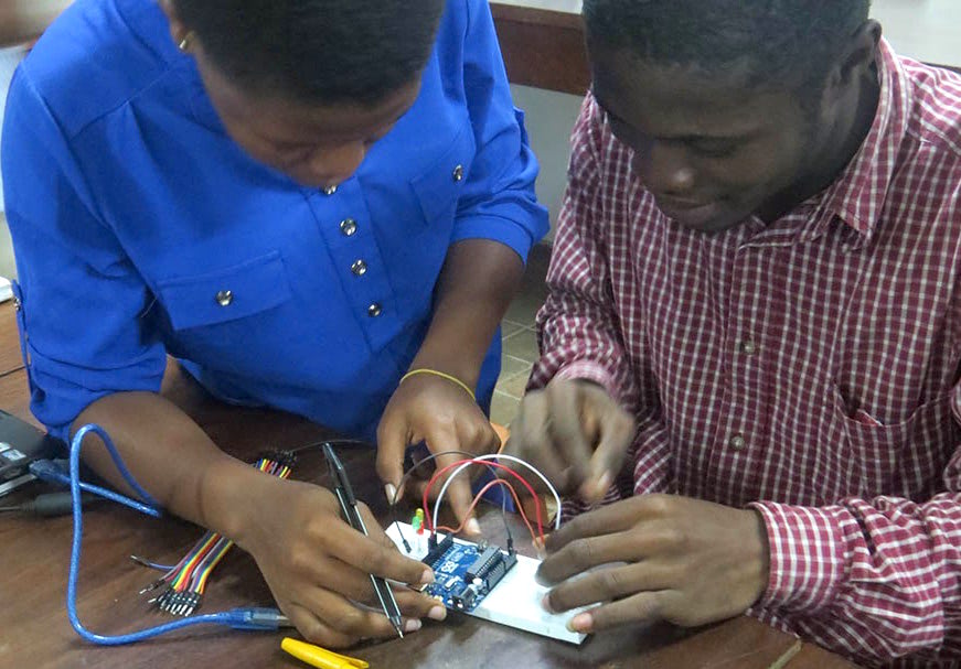 Students working with an Arduino micro-controller