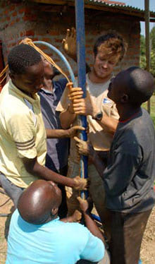 student and villagers in Kenya